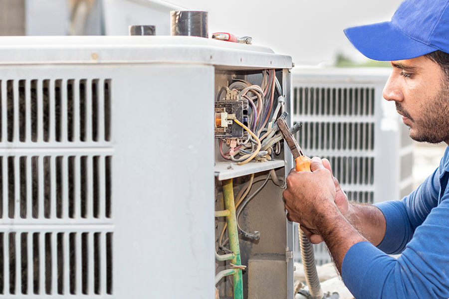 hvac technician performing maintenance on air conditioner hvac repair hvac installation miami beach fl